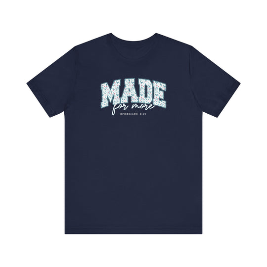 Navy-blue Made For More Tee with floral-patterned MADE slogan and EPHESIANS 2:10 reference, showcasing Faith Family Designs' unique graphic style.