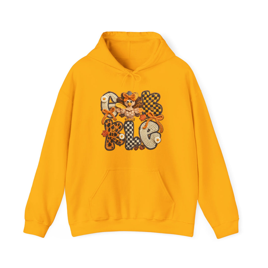 Mustard-yellow Gobble hoodie featuring a Thanksgiving-themed applique with crocheted letters and a turkey, complete with a kangaroo pocket and drawstring hood.