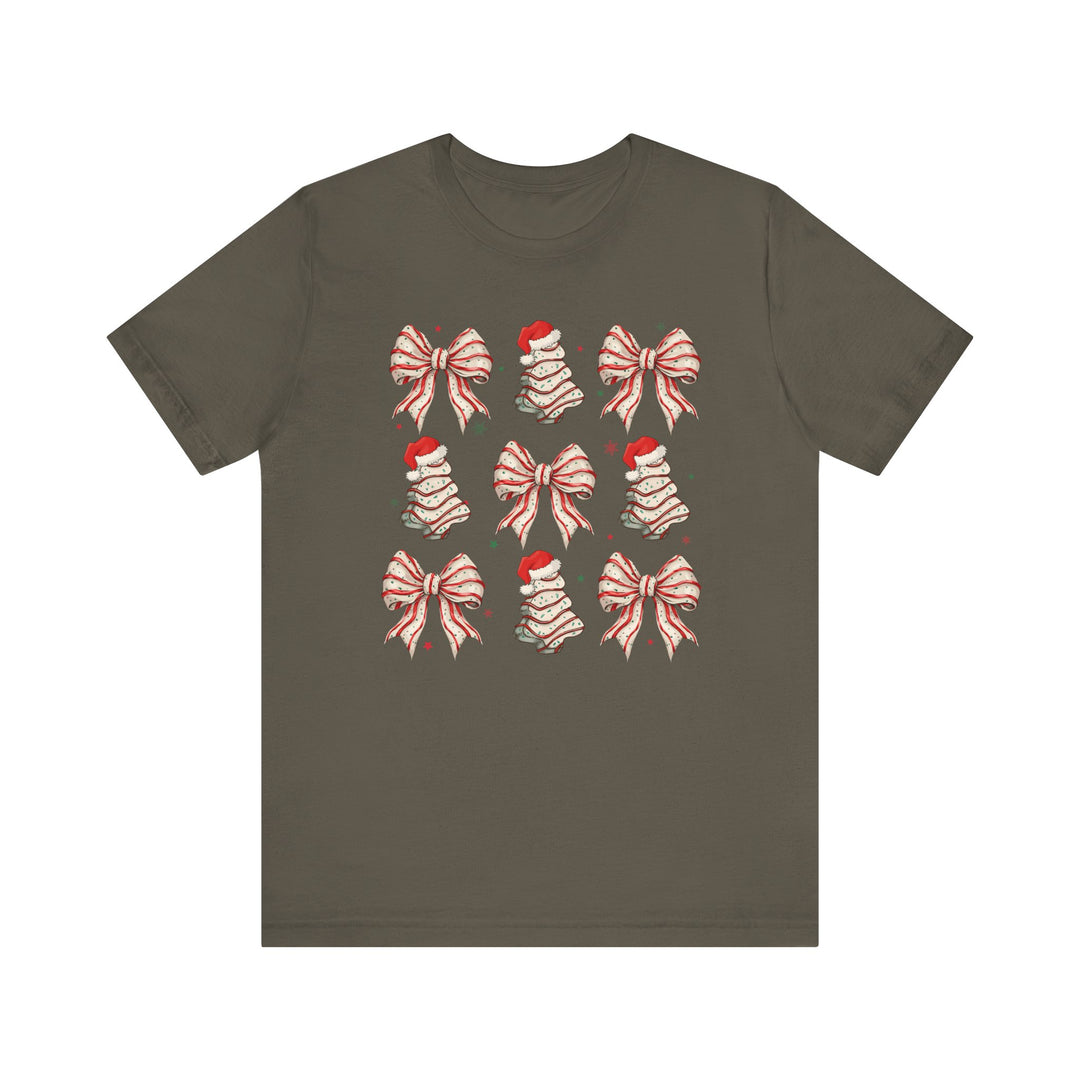 Cookies and Bows Tee features festive holiday motifs in a 3x3 grid, combining red-and-white bows and Santa-topped Christmas trees on a soft olive-green T-shirt.
