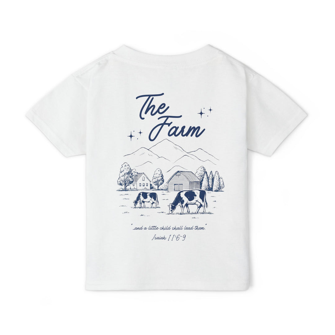Heavy Cotton™ Toddler T-shirt: Back features a navy farm scene with The Farm text, cows, barn, trees, and Isaiah 11:6-9 quote, emphasizing style and comfort.
