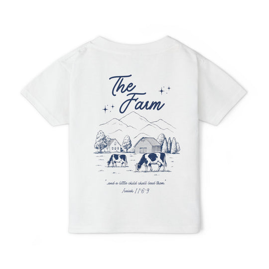 Heavy Cotton™ Toddler T-shirt: Back features a navy farm scene with The Farm text, cows, barn, trees, and Isaiah 11:6-9 quote, emphasizing style and comfort.