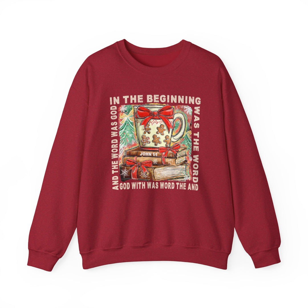 Red crewneck sweatshirt, In the Beginning Crew, features a festive mug atop books with John 1:1 text, perfect for cozy winter comfort.