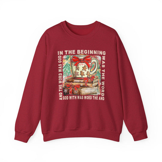 Red crewneck sweatshirt, In the Beginning Crew, features a festive mug atop books with John 1:1 text, perfect for cozy winter comfort.