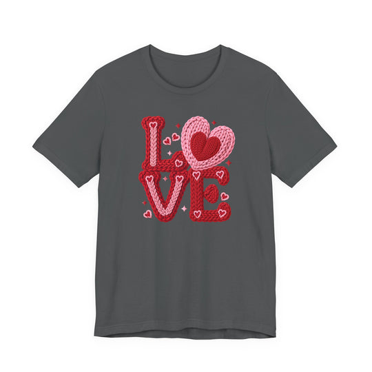 Charcoal-gray crew-neck T-shirt with LOVE graphic in red and pink, featuring a heart for the O. Soft cotton, unisex fit, by Faith Family Designs.