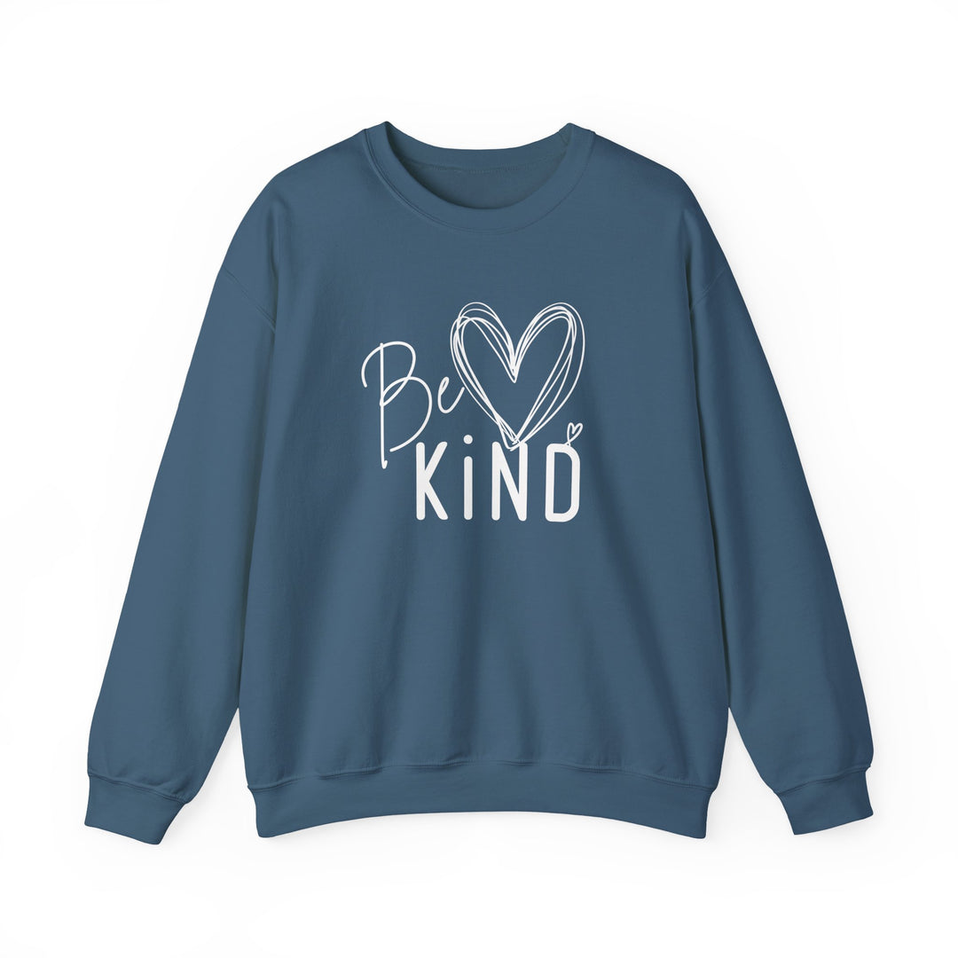 Slate-blue crewneck sweatshirt with Be KIND white graphic, featuring hand-drawn script and heart accents, emphasizing comfort and positivity.