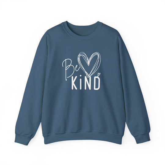 Slate-blue crewneck sweatshirt with Be KIND white graphic, featuring hand-drawn script and heart accents, emphasizing comfort and positivity.