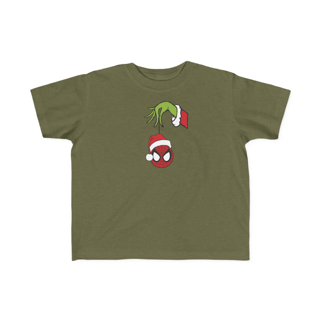 Spider Ball Christmas Toddler Tee featuring a Grinch-like hand holding Spider-Man's mask ornament, perfect for toddlers with soft, durable cotton fabric.