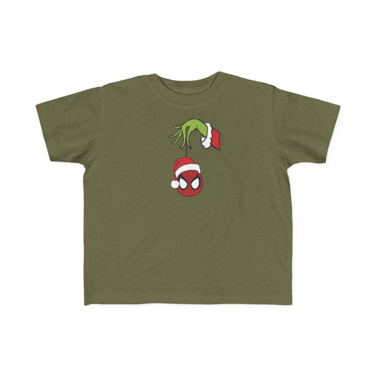 Spider Ball Christmas Toddler Tee featuring a Grinch-like hand holding Spider-Man's mask ornament, perfect for toddlers with soft, durable cotton fabric.
