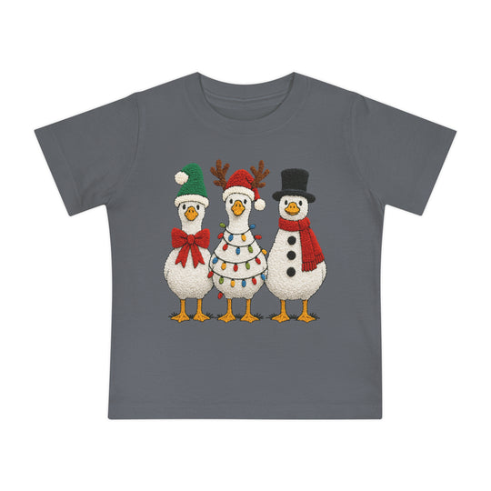 Christmas Geese Baby Tee featuring three festive cartoon “snow” birds with holiday accessories, set on a slate-gray t-shirt designed for comfort and durability.
