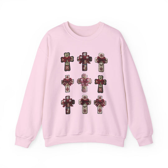 Light-pink Crosses Crew sweatshirt featuring a 3×3 grid of decorative cross appliqués with snowflake motifs, offering cozy comfort and a classic fit.