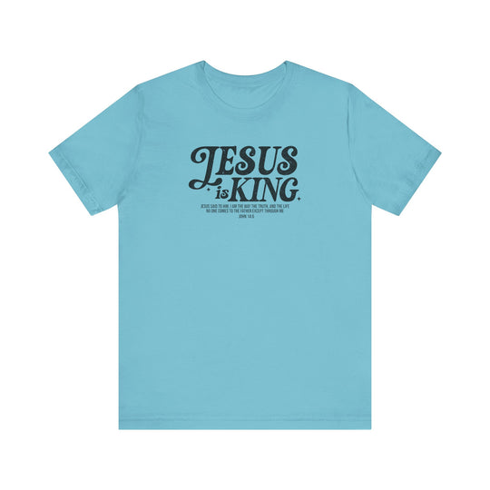 Jesus is King Tee, a blue short sleeve t-shirt with black text, offers a soft cotton feel and quality print, providing a comfortable, well-loved fit.