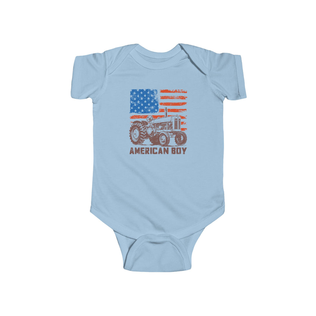 Light-blue American Boy Onesie with distressed U.S. flag and vintage tractor graphic, featuring durable, soft 100% cotton fabric and easy-change snaps for infants.