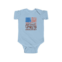 Light-blue American Boy Onesie with distressed U.S. flag and vintage tractor graphic, featuring durable, soft 100% cotton fabric and easy-change snaps for infants.