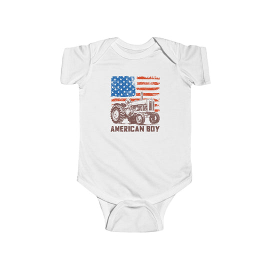 American Boy Onesie featuring a rustic American-flag motif, old-style tractor illustration, and AMERICAN BOY text. Made from soft, durable cotton with easy-change snaps.
