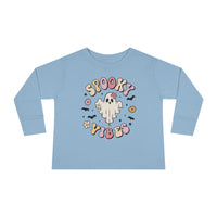 A spooky vibes toddler long sleeve tee featuring a blue shirt with a ghost and bats design. Made from 100% combed ringspun cotton, with a ribbed collar and EasyTear™ label for comfort and durability.