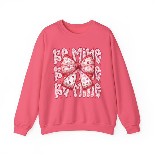 Be Mine Crew sweatshirt with a heart-patterned bow design, embodying Valentine’s Day charm, made from a comfortable polyester-cotton blend with ribbed collar.