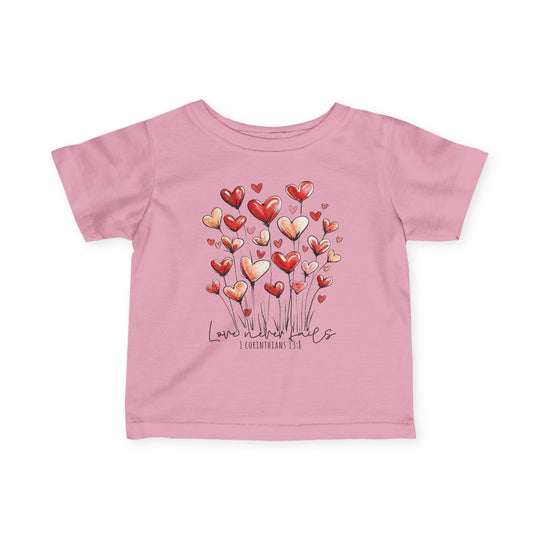 Pink toddler T-shirt with heart bouquet graphic, Love never fails script, and 1 Corinthians 13:8 reference, designed for comfort and durability.