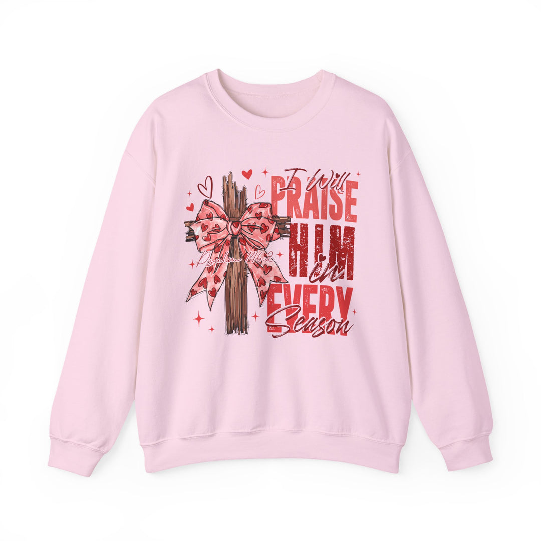 Praise in Every Season Heart Crew sweatshirt features a wooden cross with a pink bow, surrounded by hearts, sparkles, and “Psalm 146:2” reference.