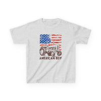 American Boy Kids Tee featuring a distressed American flag backdrop with a vintage tractor illustration, ideal for everyday wear with durable, soft heather-gray fabric.