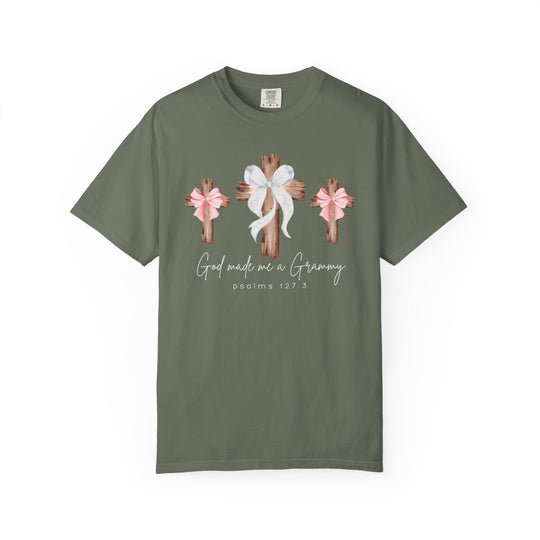 Olive-green T-shirt with three wooden crosses, middle cross with white bow, flanking crosses with pink bows, and God made me a Grammy text.