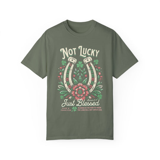 Blessed Tee: A green t-shirt featuring a detailed graphic of a horseshoe surrounded by flowers, crafted from soft, garment-dyed cotton for comfort and durability.