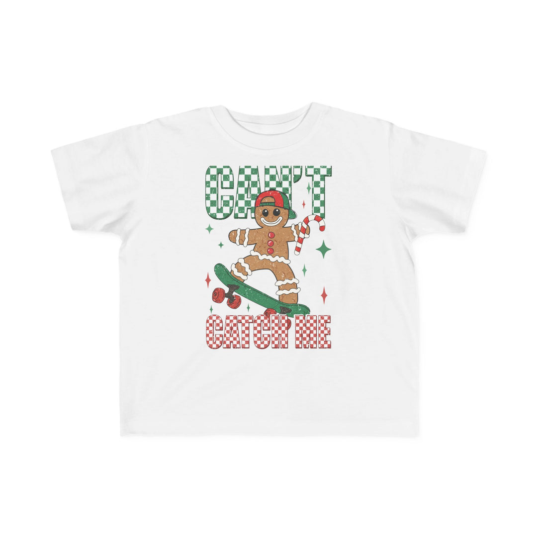 Can't Catch Me Toddler Tee featuring a gingerbread character on a skateboard, playful holiday theme, soft cotton perfect for sensitive skin, durable and high-quality print.