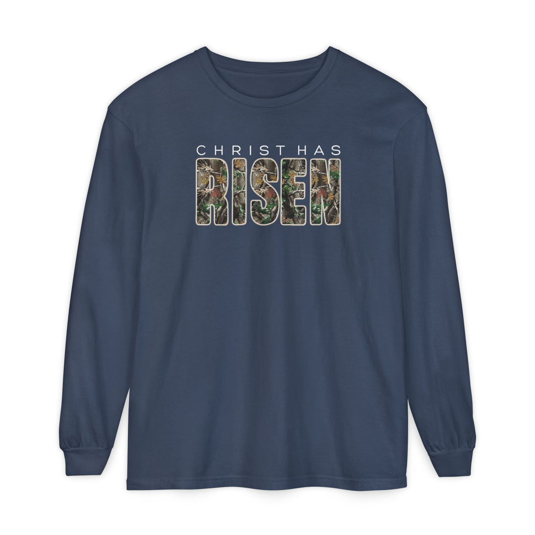 Navy-blue long-sleeve T-shirt with CHRIST HAS RISEN in bold, camouflage-patterned letters; crafted from soft, 100% ring-spun cotton for comfort.