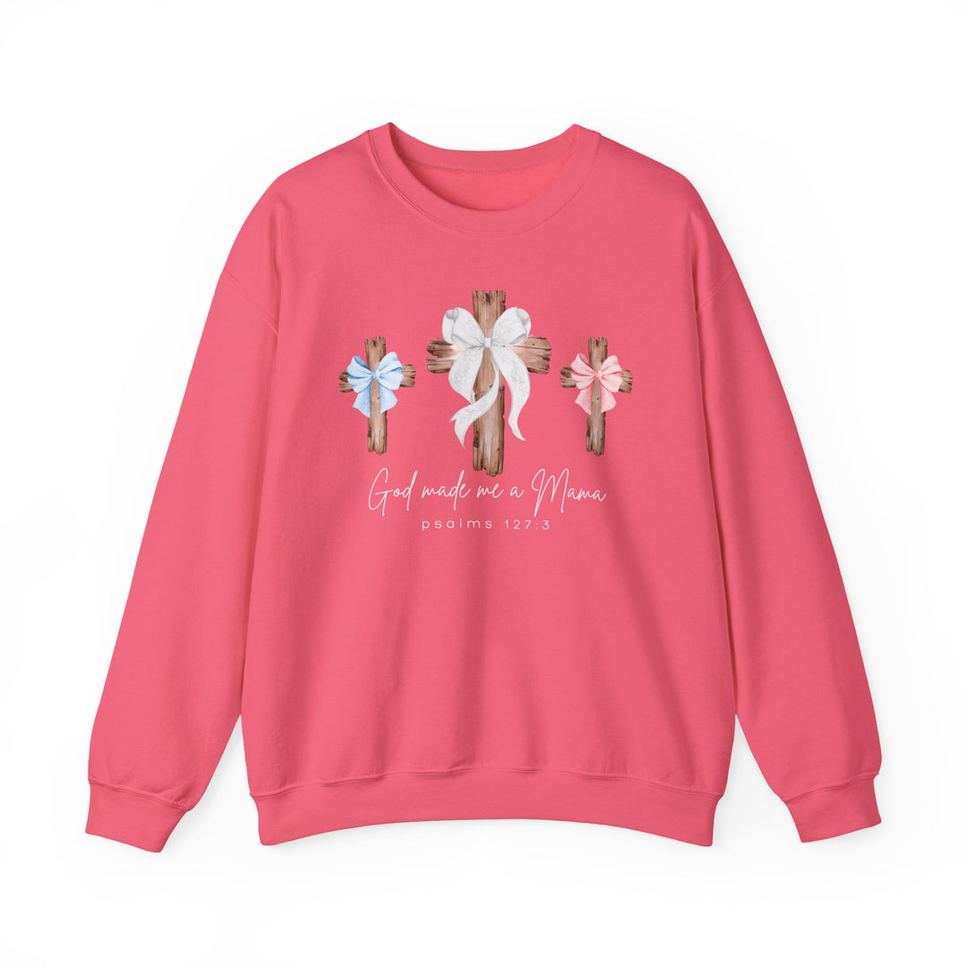 Pink crewneck sweatshirt with three wooden crosses and 'God made me a Mama, psalms 127:3' text, blending comfort and style from Faith Family Designs.