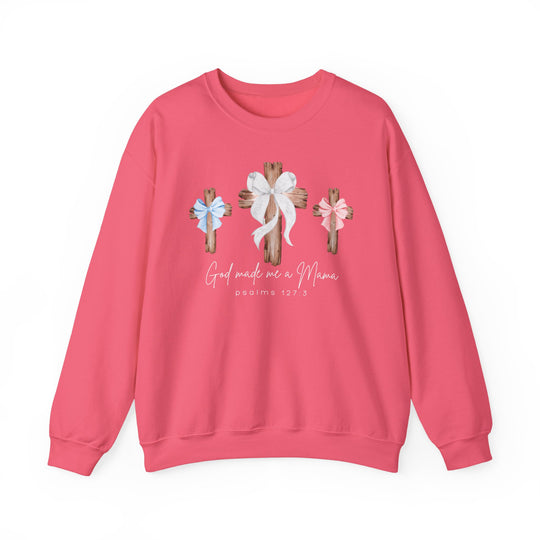 Pink crewneck sweatshirt with three wooden crosses and 'God made me a Mama, psalms 127:3' text, blending comfort and style from Faith Family Designs.