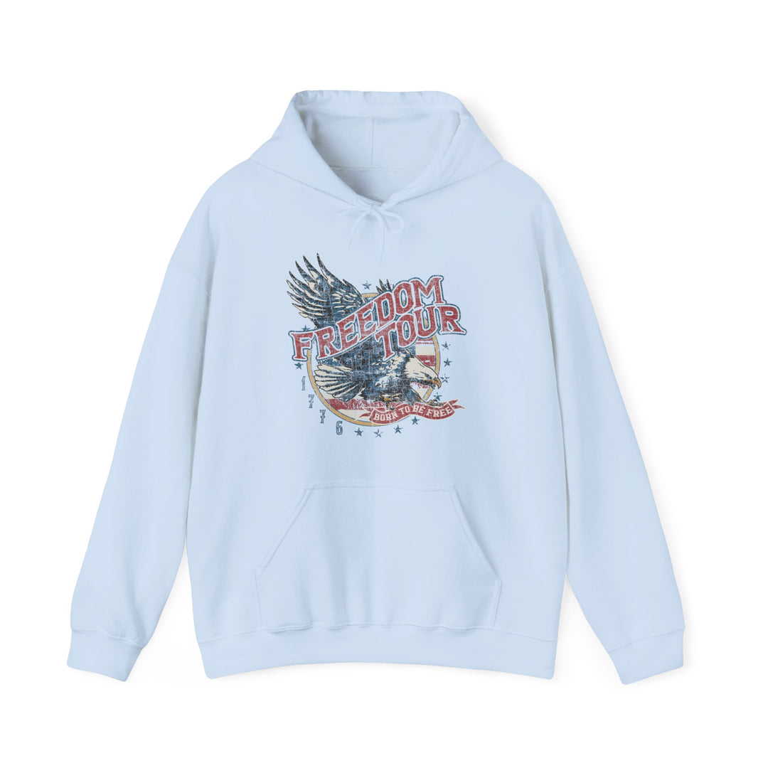 A light blue Freedom Tour Hoodie, a cozy blend of cotton and polyester. Features a kangaroo pocket and drawstring hood, perfect for printing. Unisex, medium-heavy fabric for comfort and warmth.