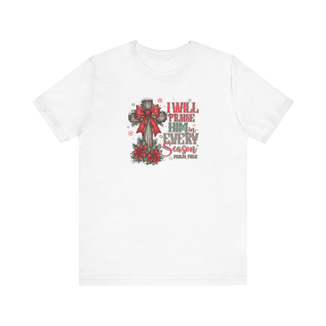 Praise Him in Every Season Tee featuring a wooden cross with a red bow, poinsettias, and snowflakes, accented by Psalm 145:2.