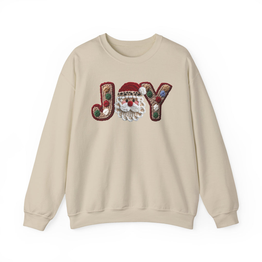 Cream-colored crewneck sweatshirt with JOY appliqué; features pom-pom accents on J and Y, and a Santa face in place of O.