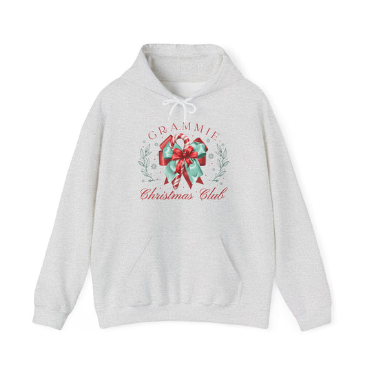 Grammie Christmas Club Hoodie with festive holly, snowflakes, and candy cane design, featuring a drawstring hood and kangaroo pocket for cozy winter comfort.