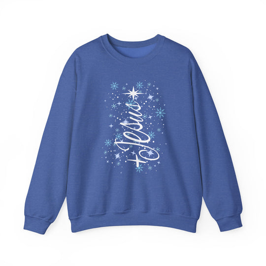 Blue crew-neck sweatshirt with Believe in cursive, adorned with stars and snowflakes, embodying festive spirit. Durable, cozy blend for cold weather. Jesus Tree Crew design.