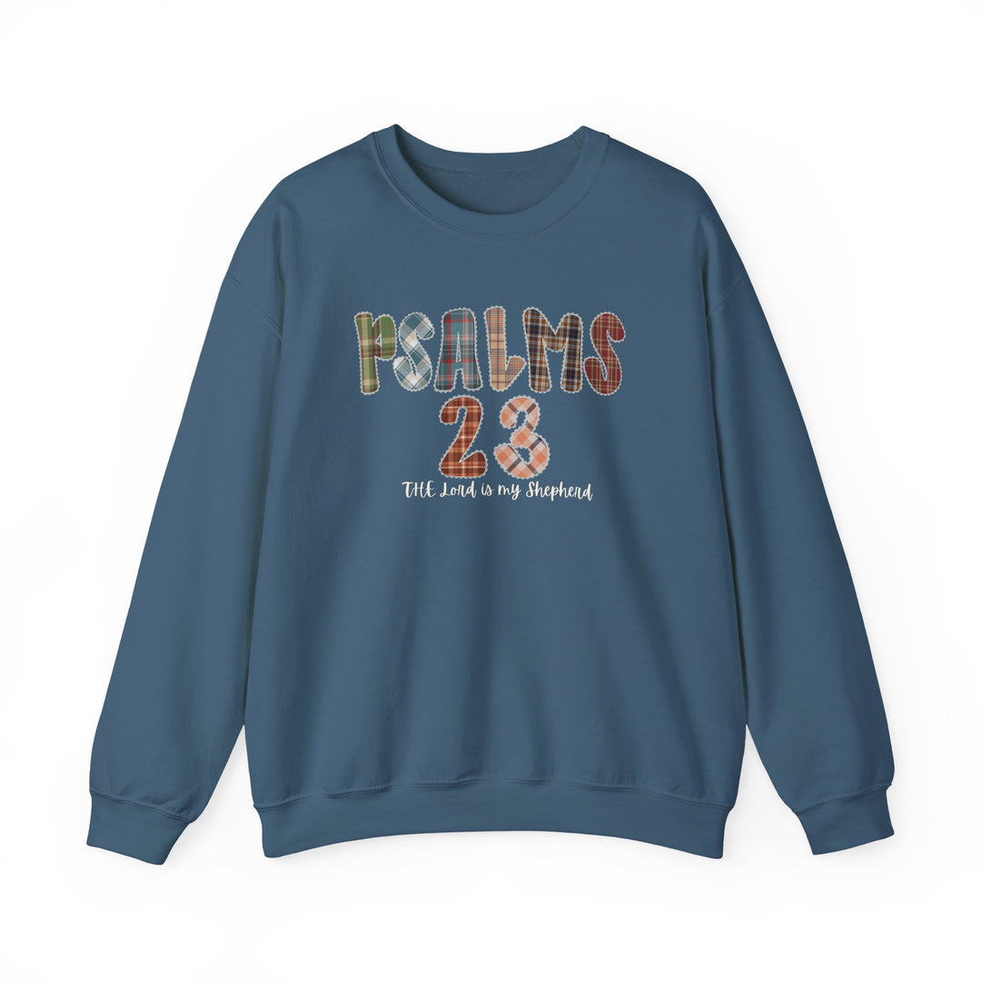 Blue crewneck sweatshirt with PSALMS 23 in plaid font and The Lord is my Shepherd in white script, embodying Faith Family Designs' unique style.