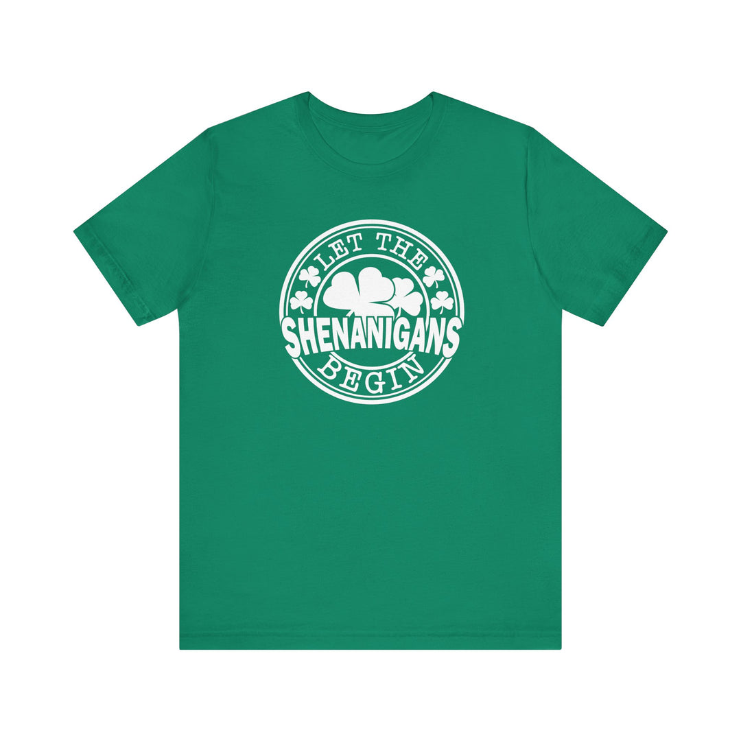 Let The Shenanigans Begin Tee: A green short sleeve t-shirt with white text, featuring a comfortable retail fit and ribbed knit collars.