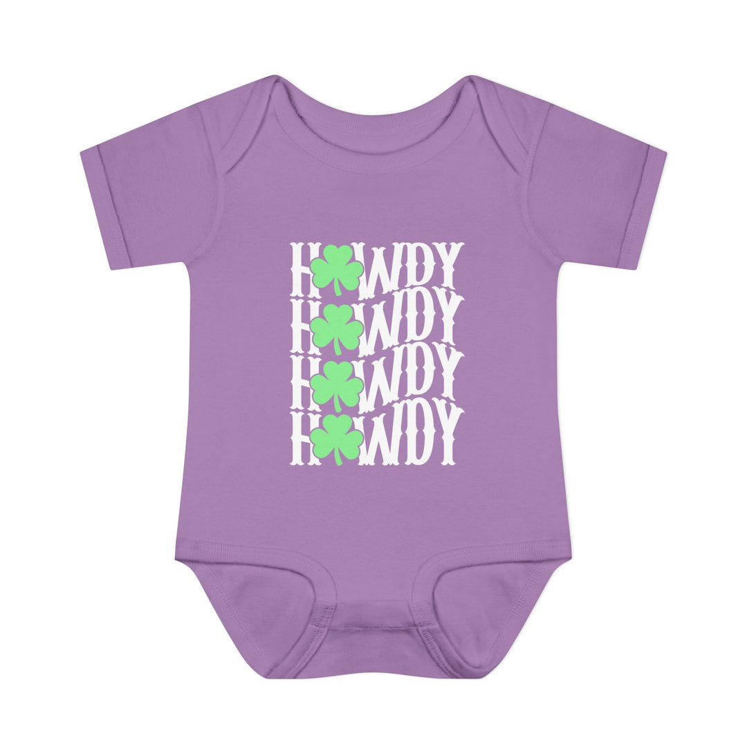 Howdy Lucky Onesie: A purple baby bodysuit featuring white text and green clovers, made from soft, 100% combed ringspun cotton, designed for infant comfort and ease.