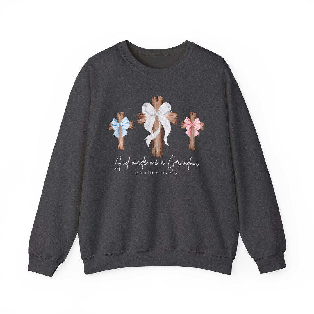 God Made Me a Grandma sweatshirt featuring three wooden crosses and script text, blending comfort with faith-inspired design from Faith Family Designs.