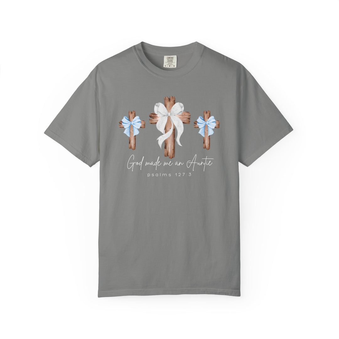 Heather-gray t-shirt featuring three rustic wooden crosses with bows and the phrase “God made me an Auntie,” ideal for faith-inspired, casual wear.