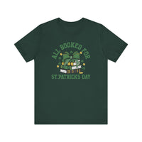 Booked for St. Patrick's Day Tee featuring a stack of books with a bow design, short sleeves, and ribbed knit collar, offering a comfortable fit.