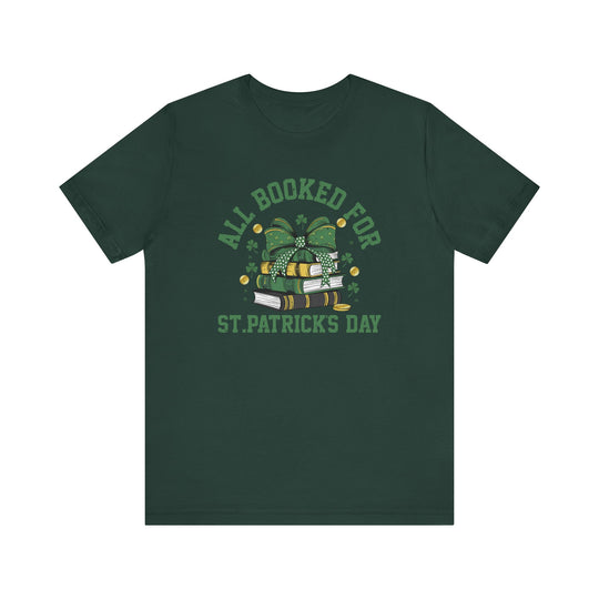 Booked for St. Patrick's Day Tee featuring a stack of books with a bow design, short sleeves, and ribbed knit collar, offering a comfortable fit.