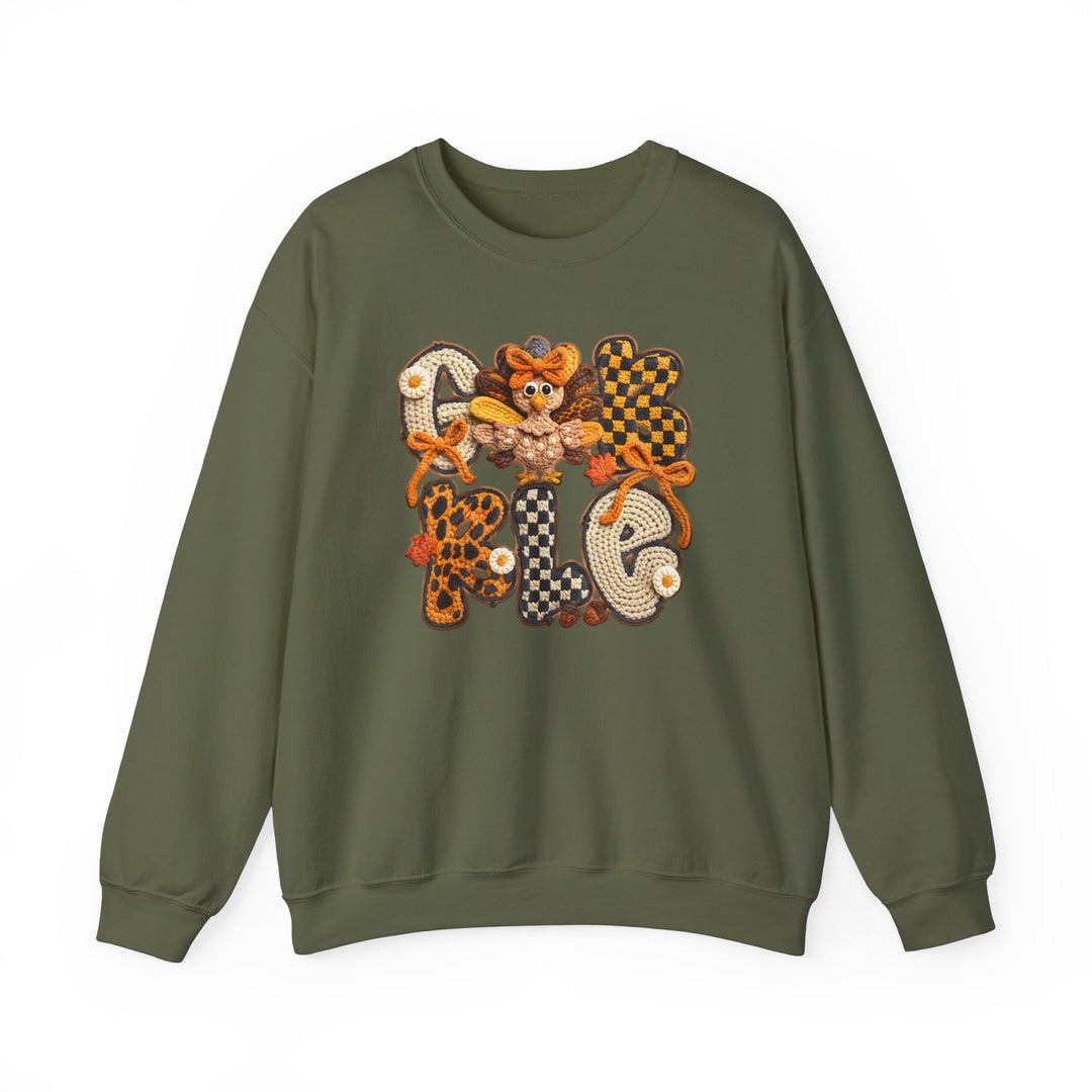 Olive-green Gobble Crew sweatshirt with autumn-themed graphic, featuring GOBBLE in vibrant letters and cartoon turkey, perfect for cozy fall gatherings.