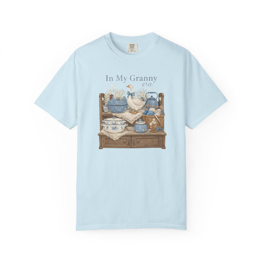 In My Granny Era Tee featuring a cozy vintage still life with ceramic goose, porcelain tureen, and yarn basket, evoking nostalgic charm.
