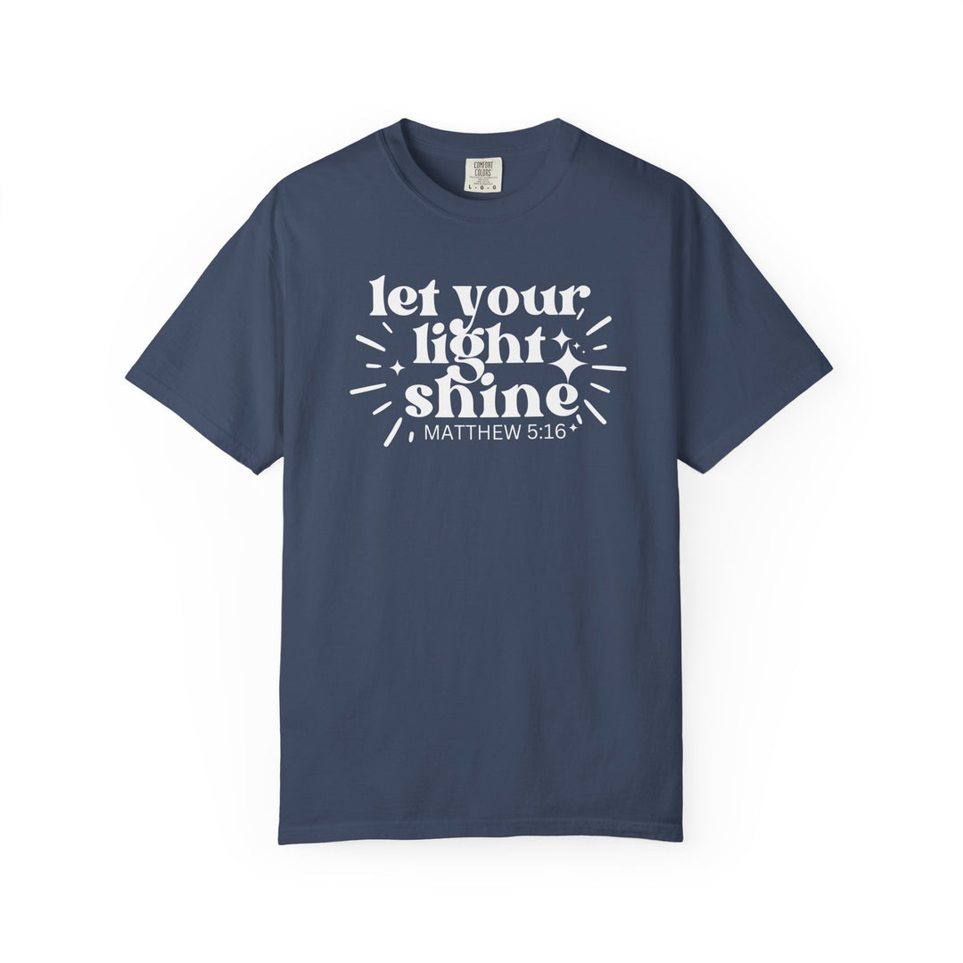 Let Your Light Shine Tee with 'MATTHEW 5:16' in white on navy-blue cotton, featuring spark-and-ray accents, designed for comfort and durability.