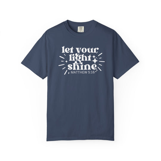 Let Your Light Shine Tee with 'MATTHEW 5:16' in white on navy-blue cotton, featuring spark-and-ray accents, designed for comfort and durability.
