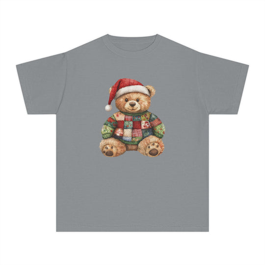Christmas Bear Kids Tee features a grey T-shirt with a teddy bear in a Santa hat and patchwork sweater, perfect for kids' comfort and play.