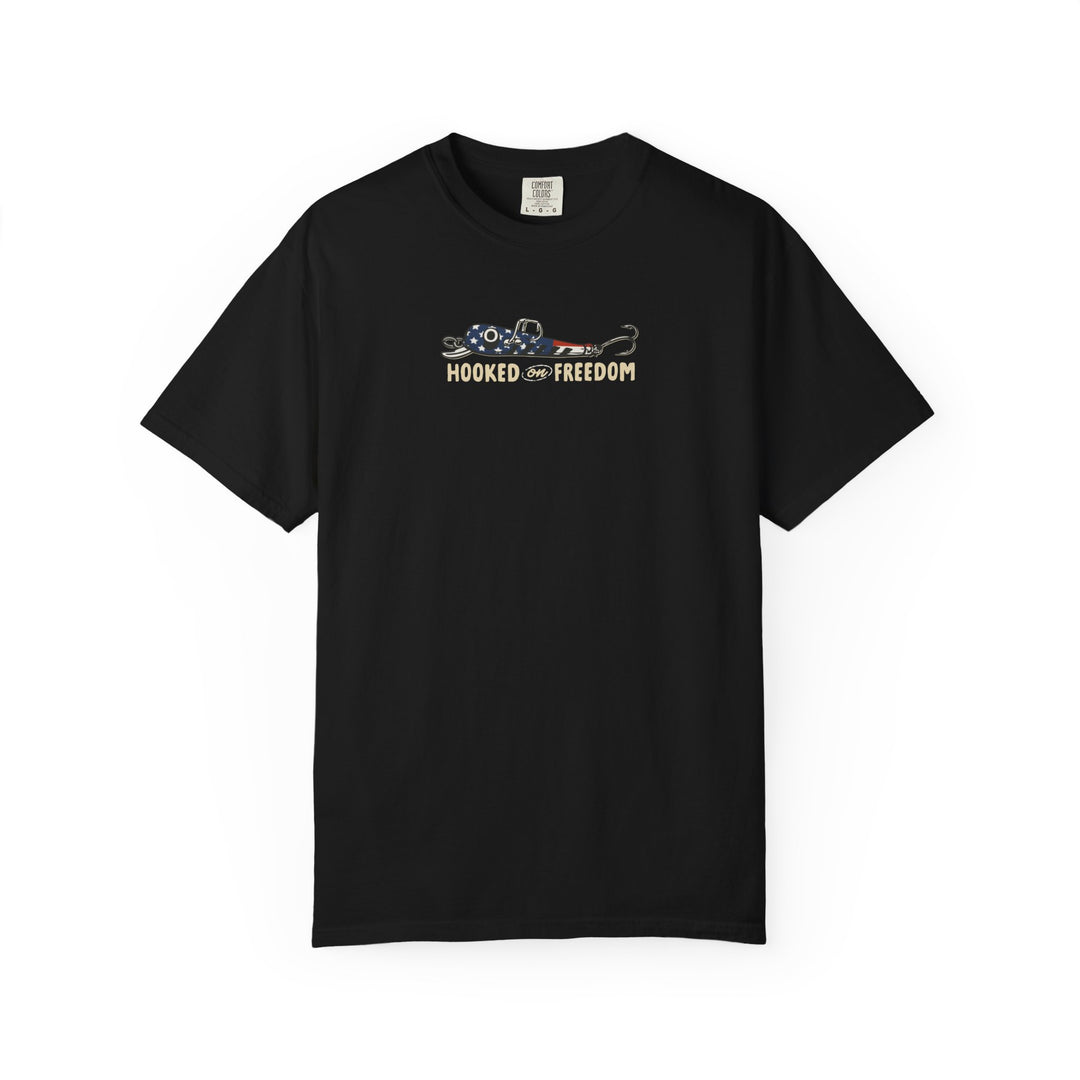 Black crew-neck 'Hooked on Freedom' tee features a red, white, and blue fishing lure graphic, emphasizing comfort and style with its relaxed fit and durable construction.