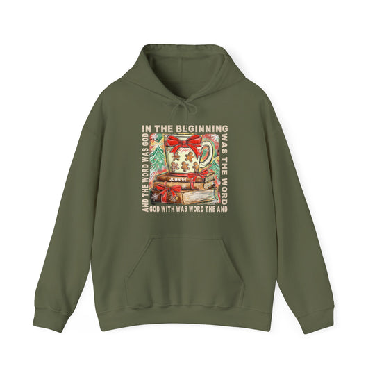 In the Beginning Hoodie features a festive design with a mug, books, snowflakes, and John 1:1 text, offering warmth and style for cold days.