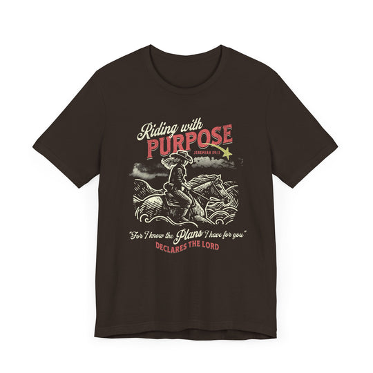 Riding for a Purpose Tee featuring a cowboy graphic, unisex jersey, soft cotton, ribbed collar, and dual side seams for lasting shape.