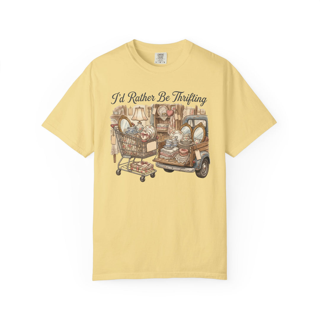 “I'd Rather Be Thrifting Tee” featuring a vintage-style illustration of a shopping cart and pickup truck loaded with thrifted treasures like dishes, textiles, and décor.